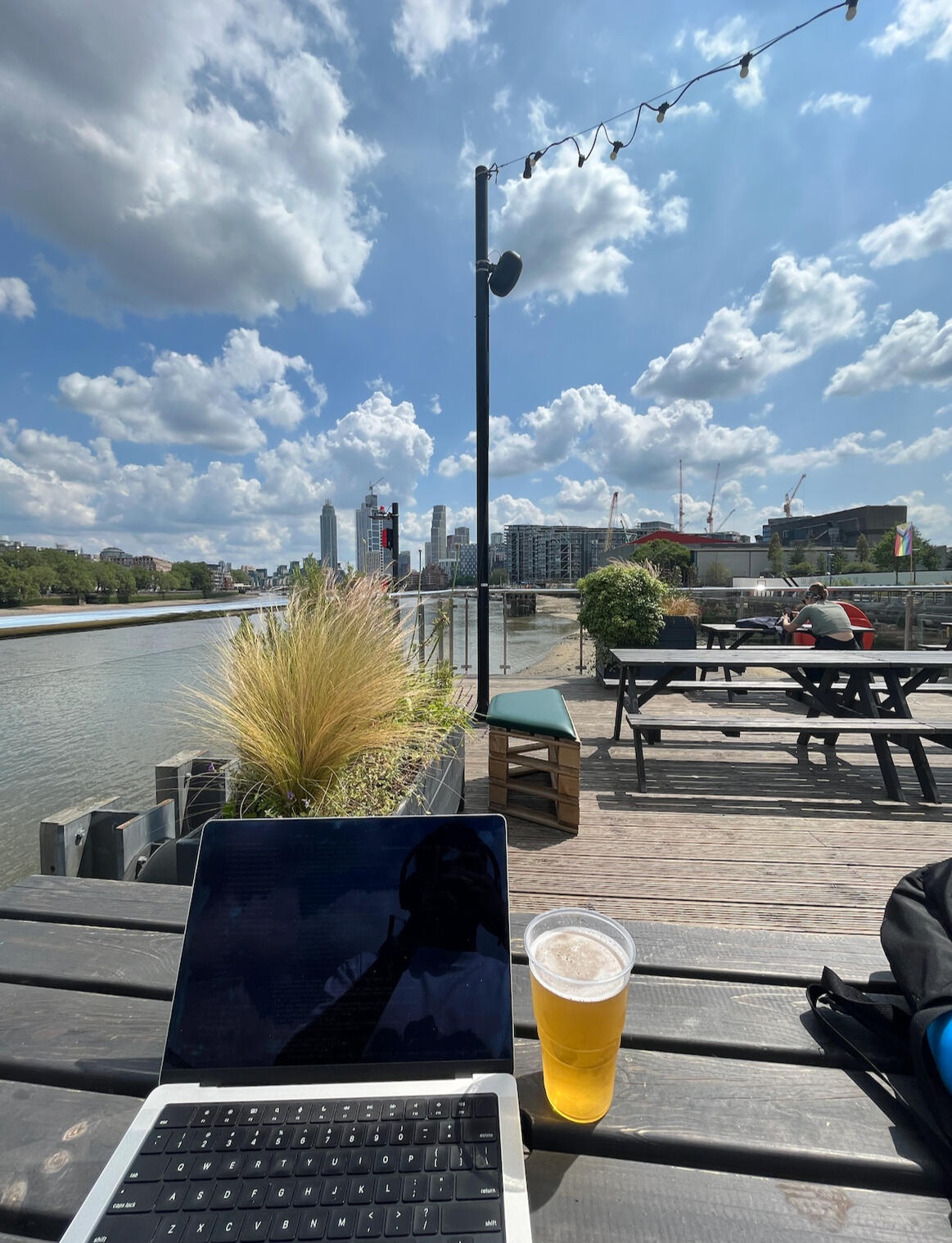 Working on a laptop next to the water
